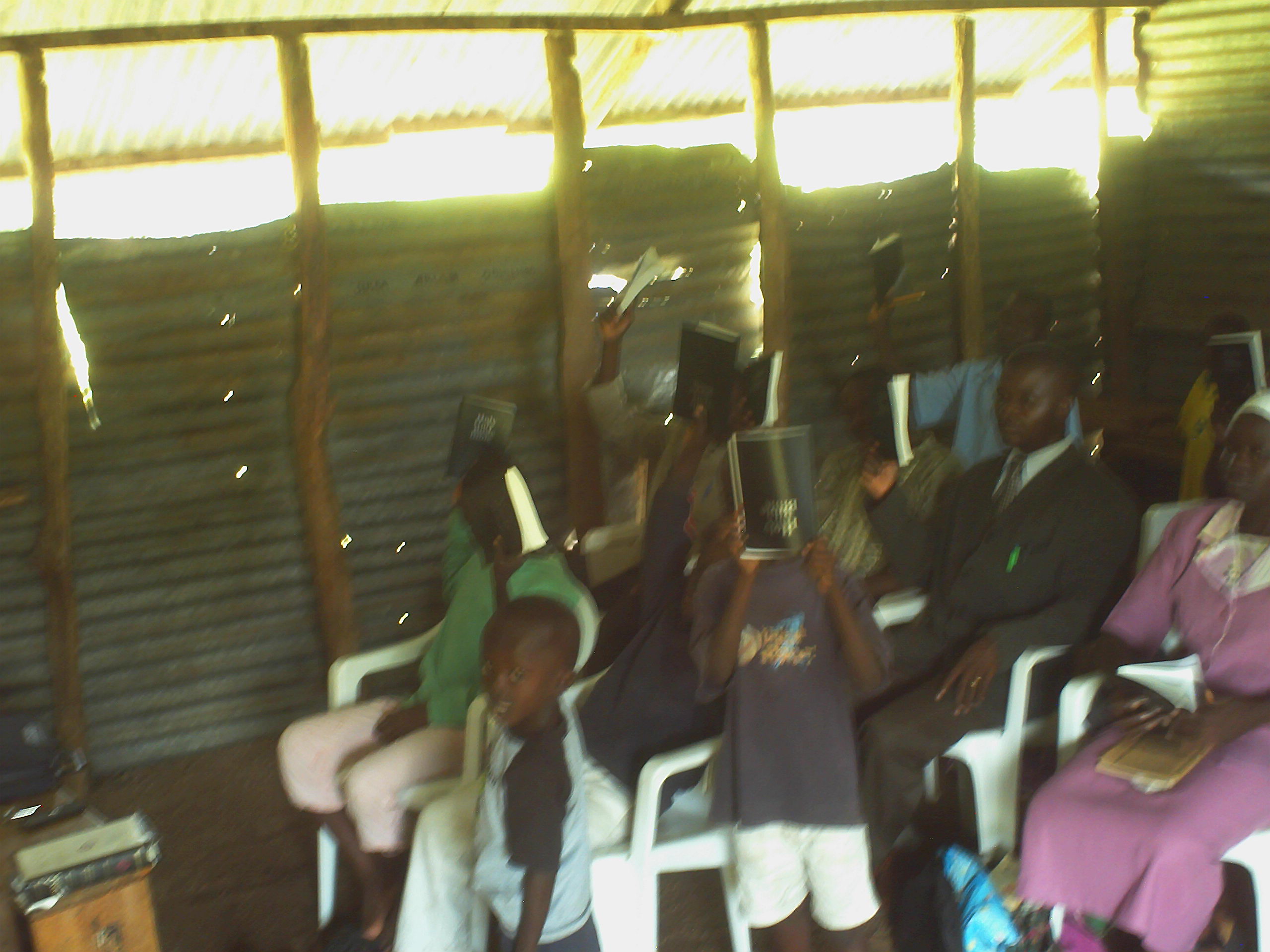 Church members with new Bibles